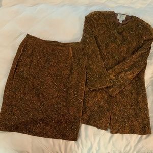 Cocktail suit with long jacket and short skirt